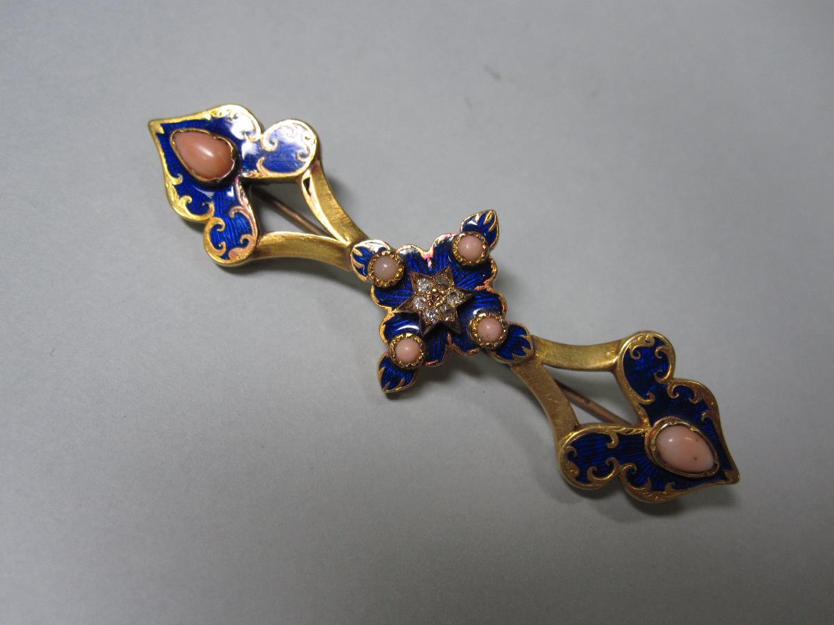 A mid 19th century enamel, coral and diamond brooch, designed as a central cruciform motif with a