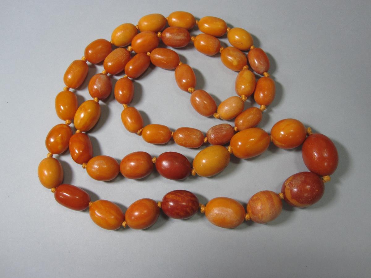 A vintage butterscotch amber bead necklace and another, the first of graduated 15-23mm long oval - Image 4 of 8