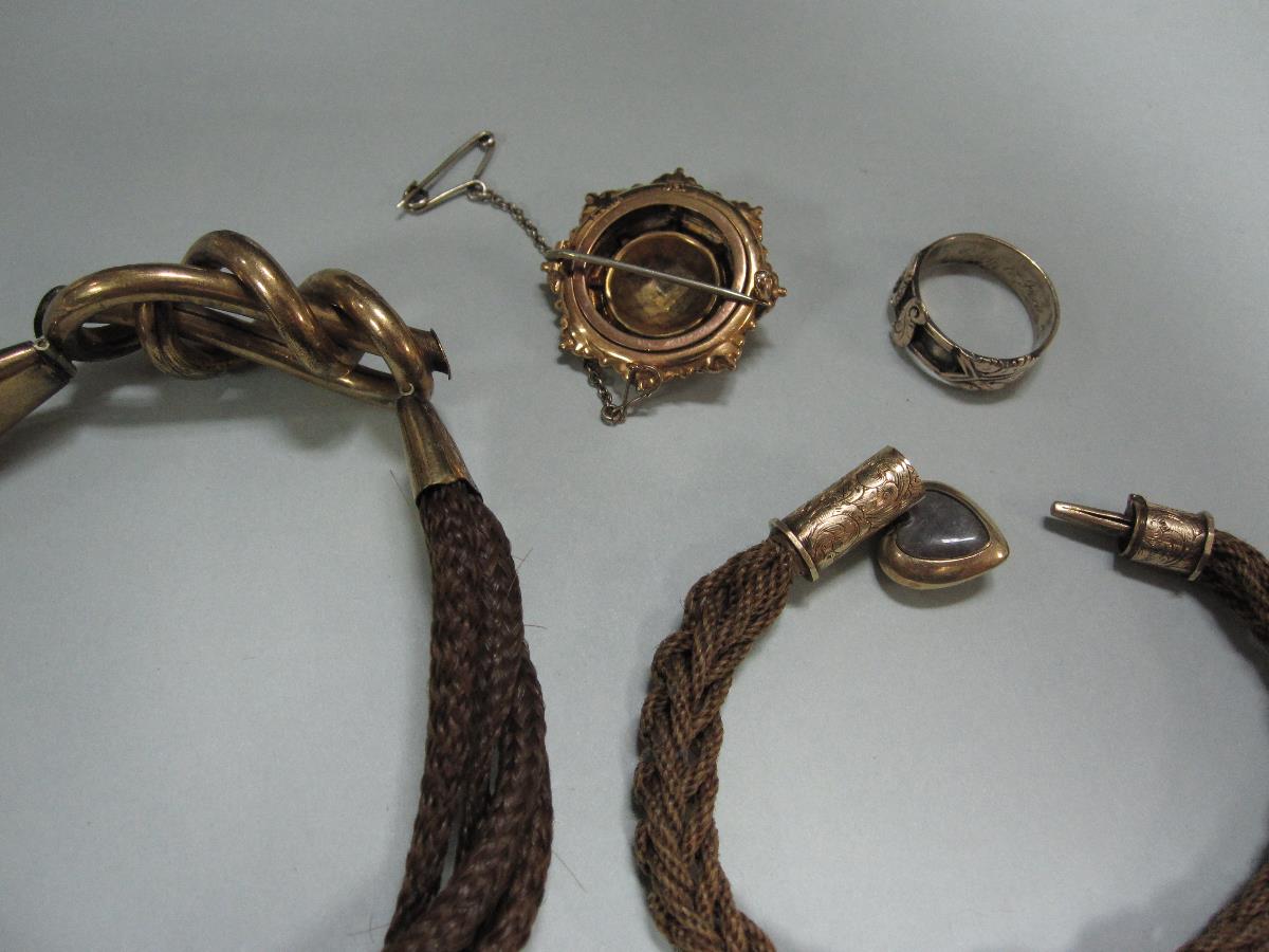 Two 19th century hairwork bracelets together with two other items of Victorian memento jewellery, - Image 2 of 5