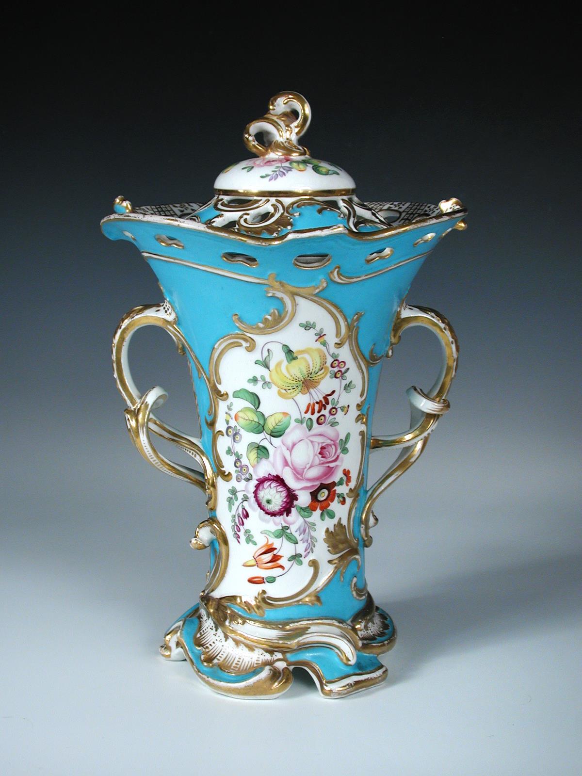 A mid 19th century pot pourri vase and cover, the handles and rococo piercings of the cover and rim