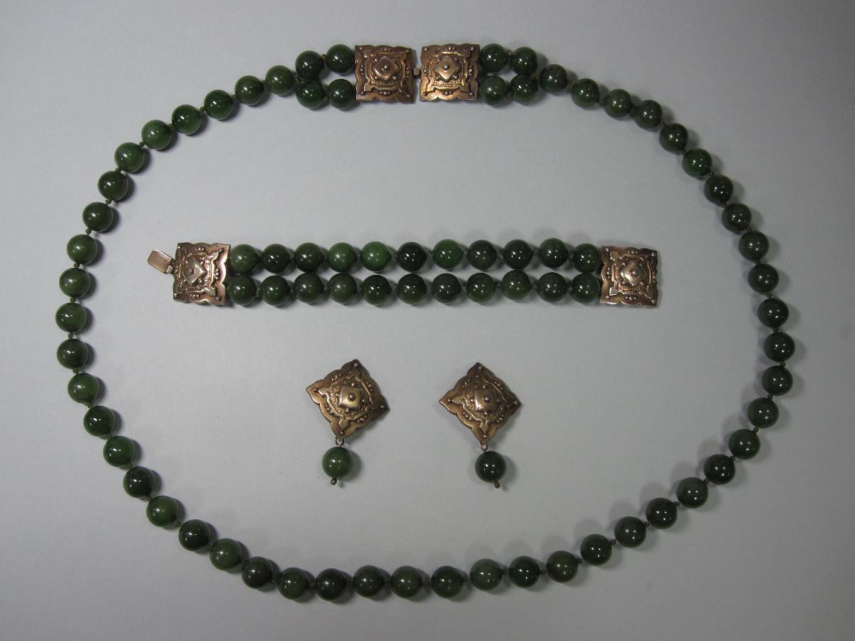 A nephrite jade bead suite with silver gilt fittings, the bracelet with a double row of 12-12.5mm