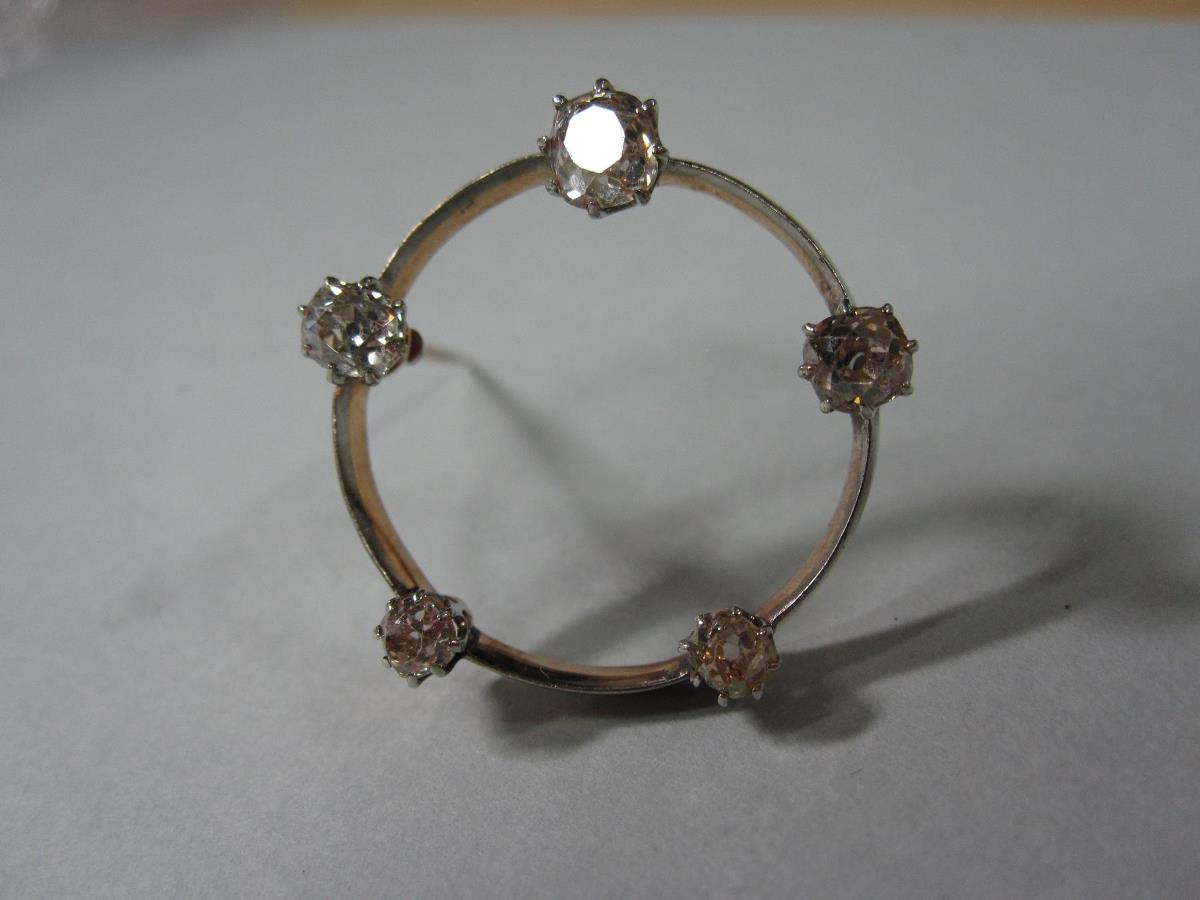 An old cut diamond hoop brooch, the knife edge 2.4cm diameter circlet claw set regularly with five