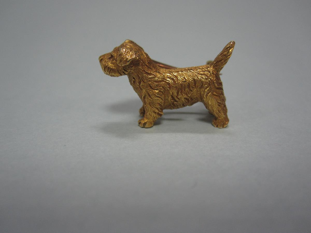 A vintage dog brooch, the realistically modelled and wire-hair textured standing Norfolk terrier,