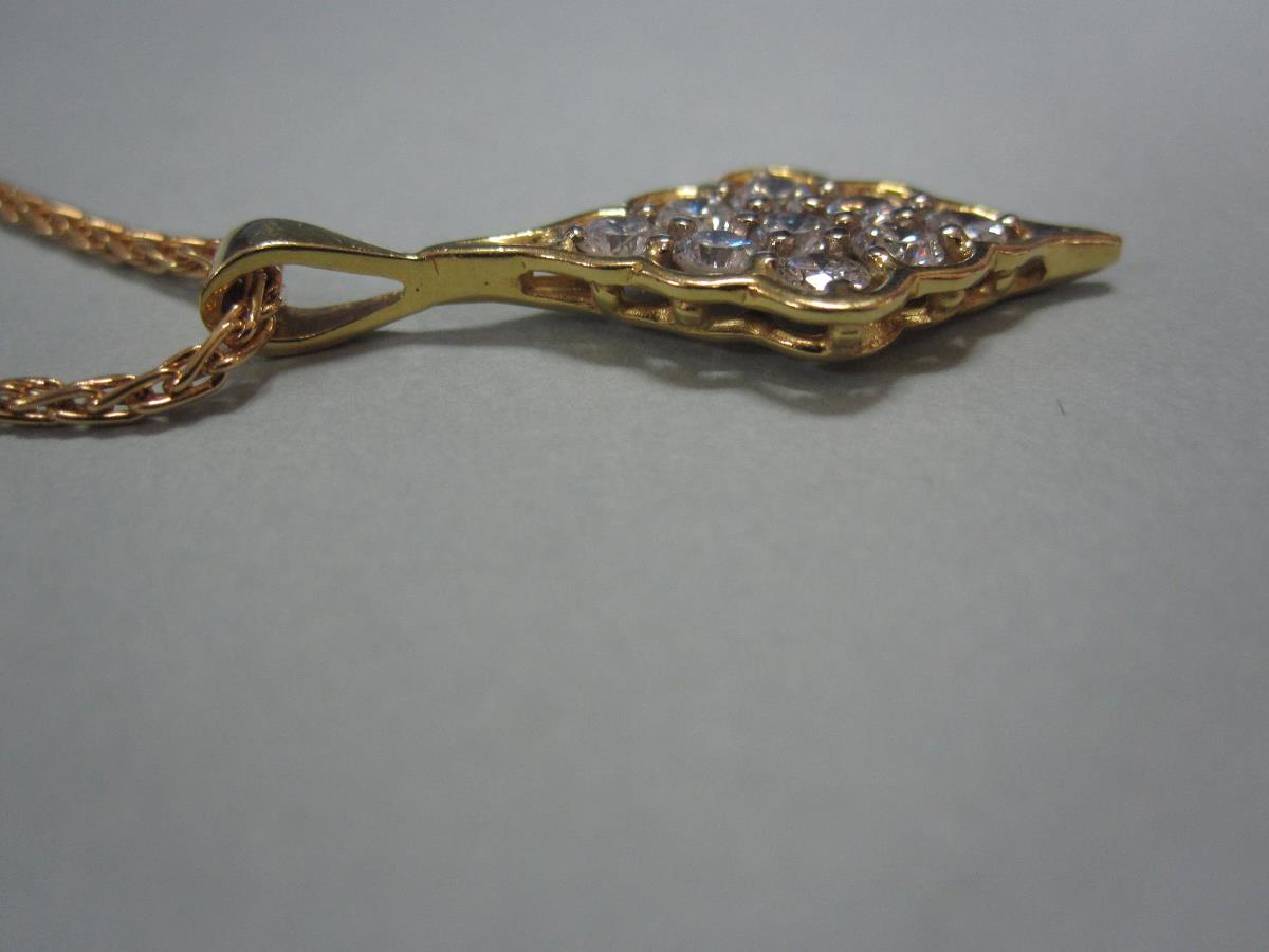 A modern diamond and 18ct gold pendant and chain, the pendant of scallop-edged diaper form set - Image 2 of 4