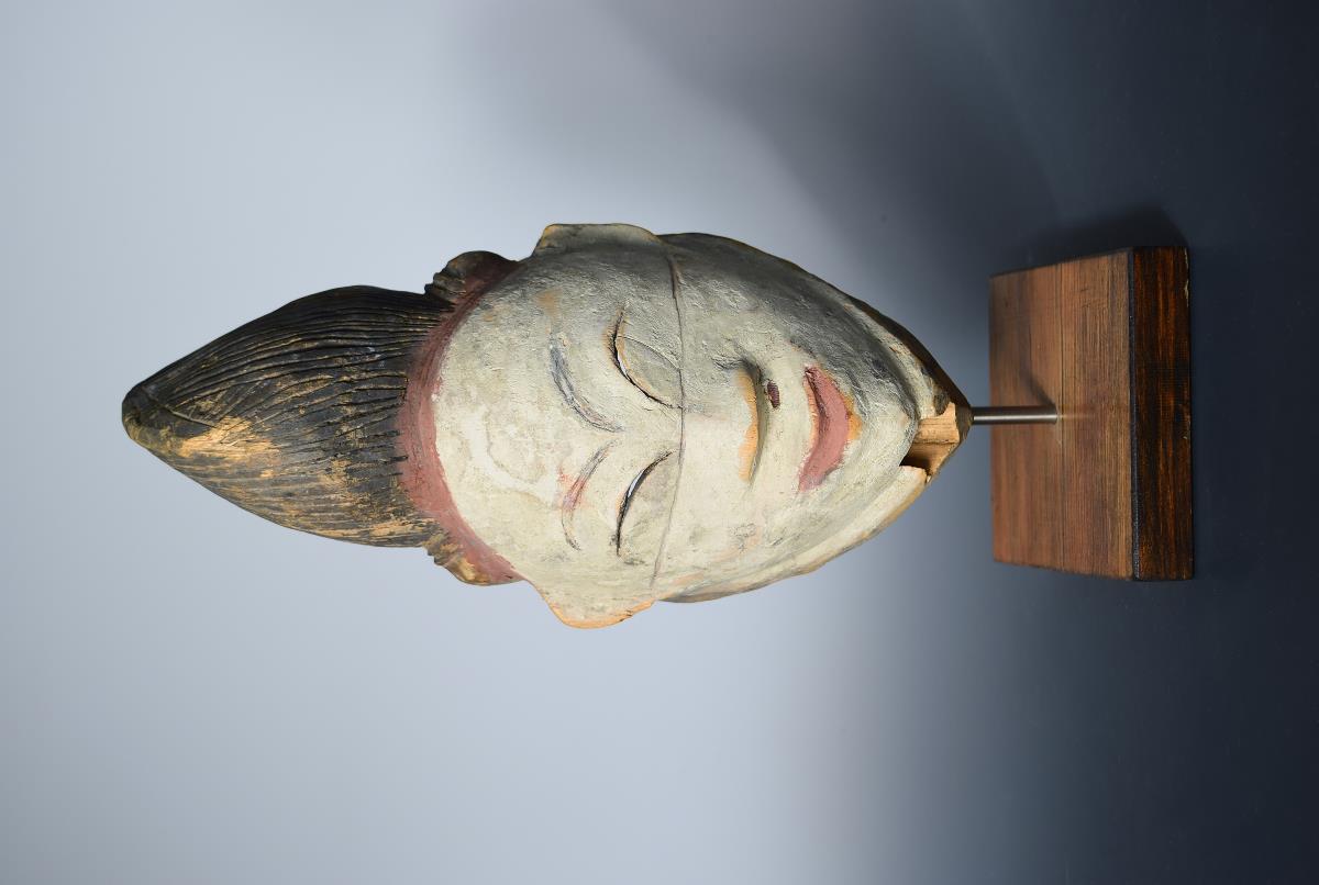 An early 20th century Punu Gabon wooden mask for a stilt dance, modelled as the head of a dead