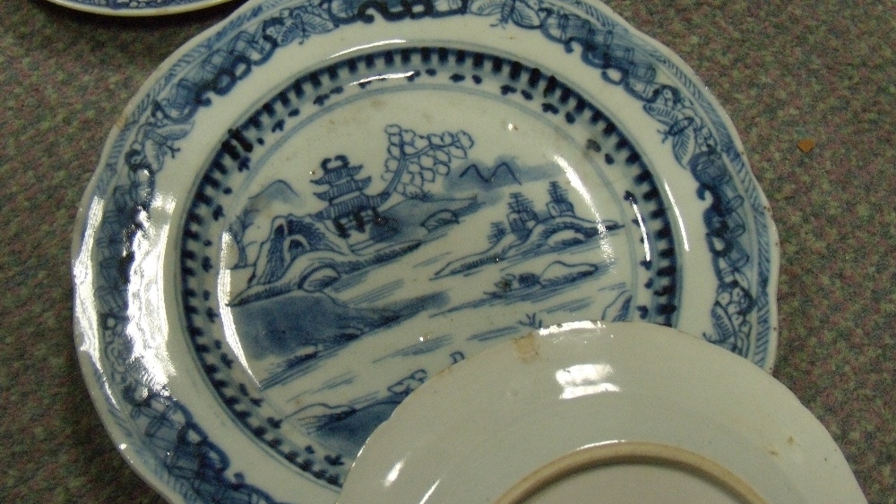 A set of thirteen and two other 18th century blue and white plates, each variously painted with - Image 2 of 2