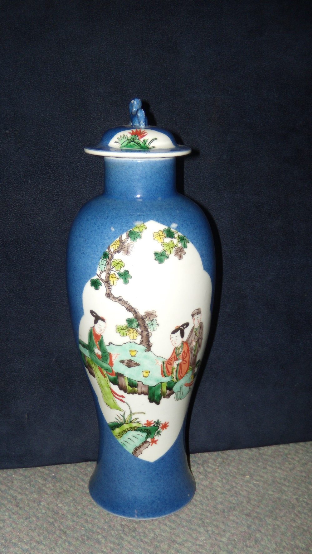 A 19th century famille verte baluster vase and cover, the baluster body painted with two lobe