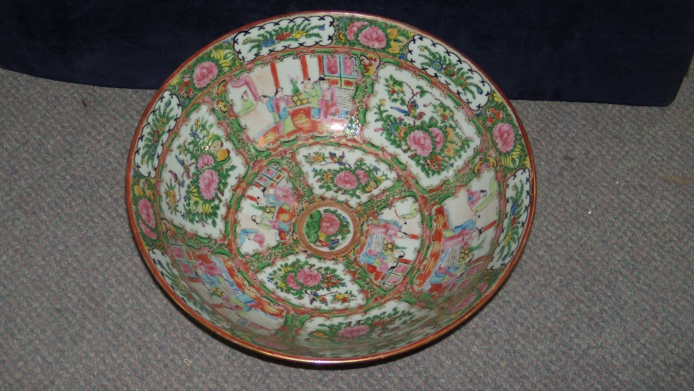 A 20th century Canton bowl painted with alternating garden and figural panels, `Made in China` mark