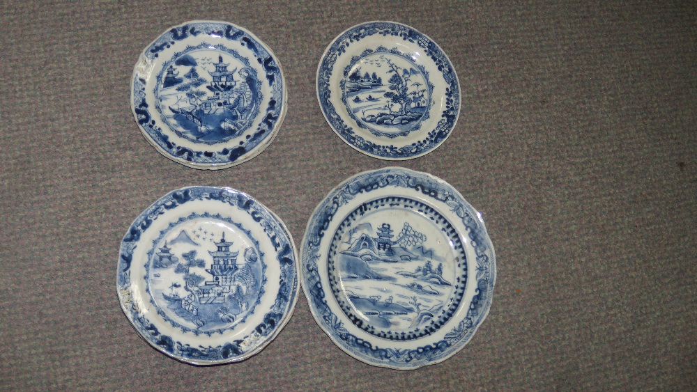 A set of thirteen and two other 18th century blue and white plates, each variously painted with