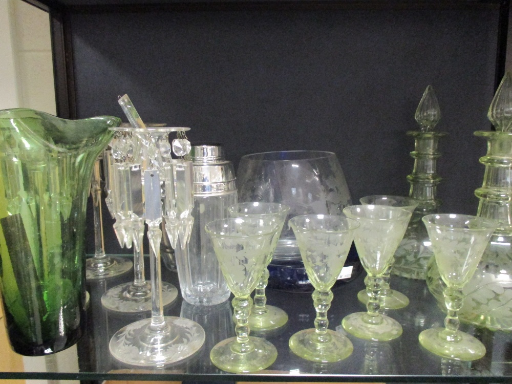 A pair of pale green uranium glass triple ring neck decanters, six glasses and various other glass