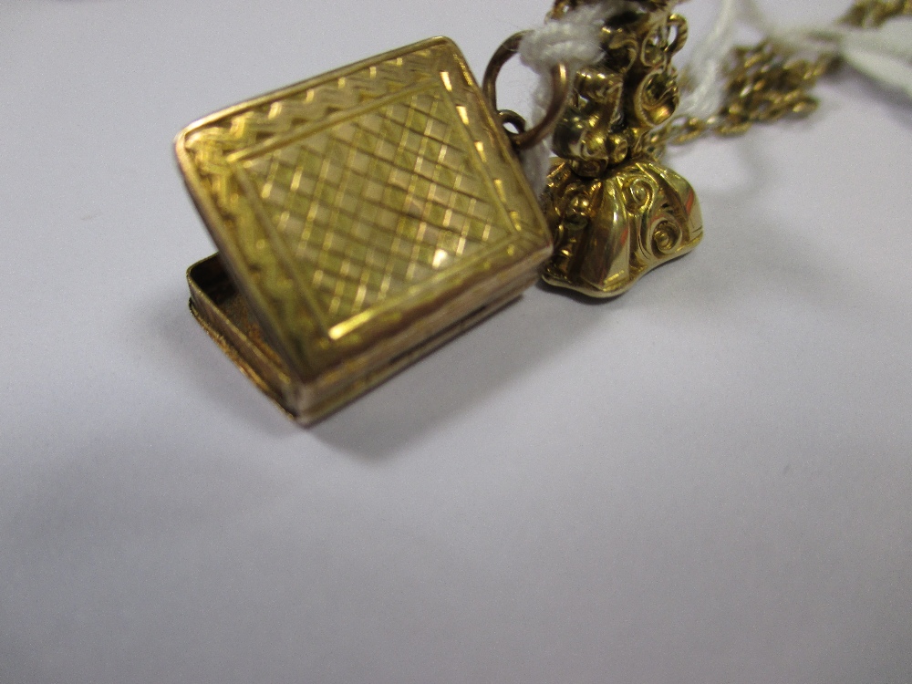 A yellow metal vinaigrette in the form of a book, a citrine fob and a quantity of assorted charms - Image 4 of 4
