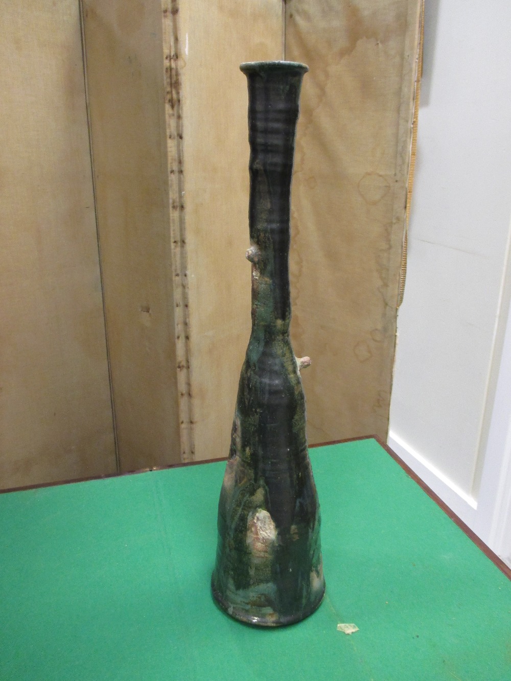An Aki Moriuchi tall stoneware vase, decorted in deep greys and metalic glazes, 63cm high