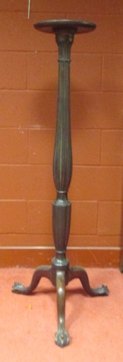 A mahogany torchere, the carved and reeded column on a tripod base, 145cm high