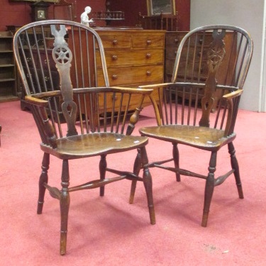 A pair of ash and elm yewwood wheel back Windsor chairs (2)