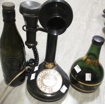 An early telephone, a music box bottle and an Ivinghoe glass beer bottle (3)