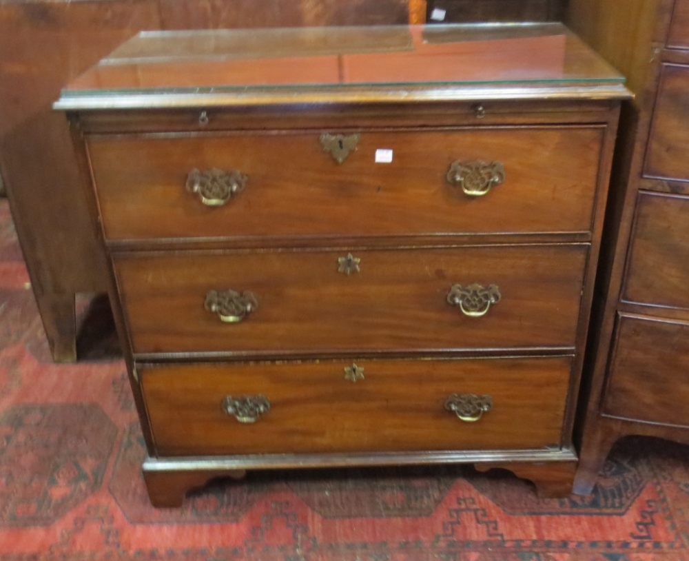 A 19th century mahogany chest of three drawers and brushing slide above. Height 82cm, Depth 45cm,