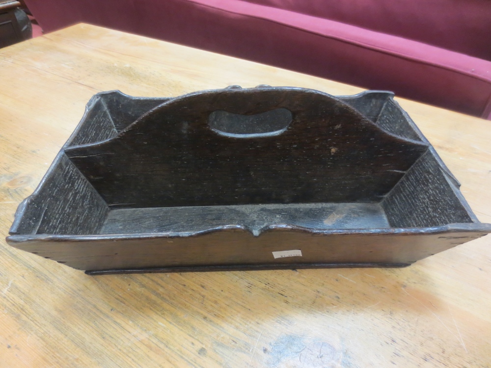 An early 19th century oak cutlery tray