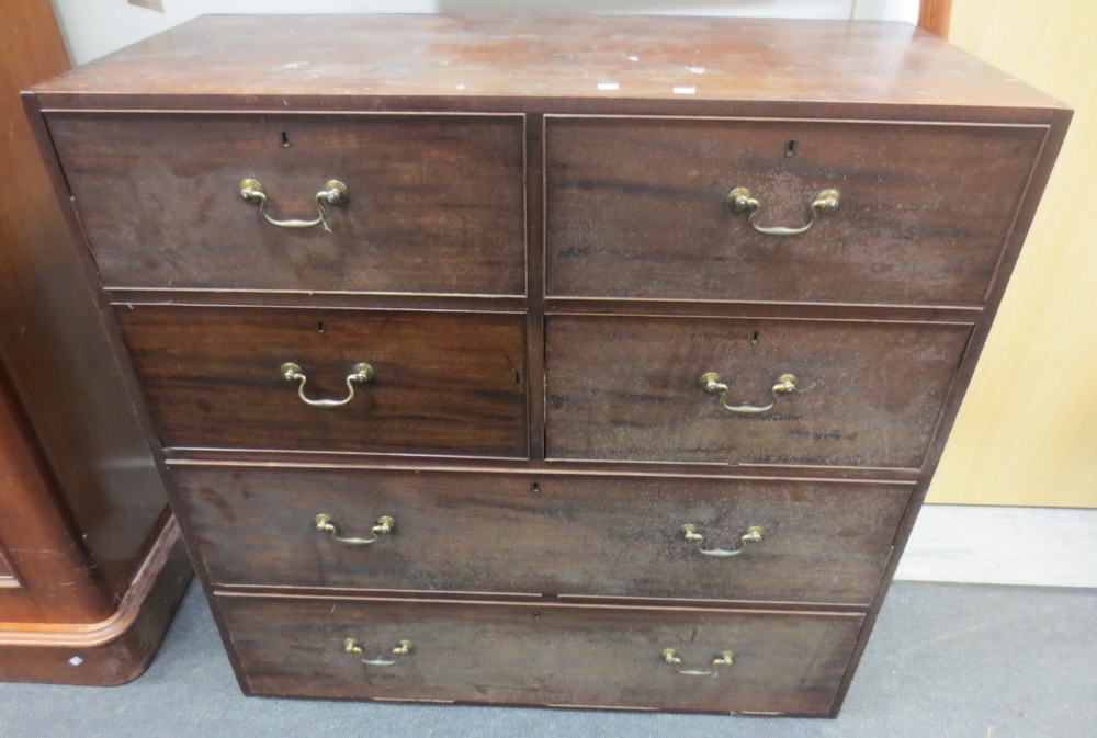 A mahogany chest of four short and two long drawers together with a glazed mahogany book case (2).