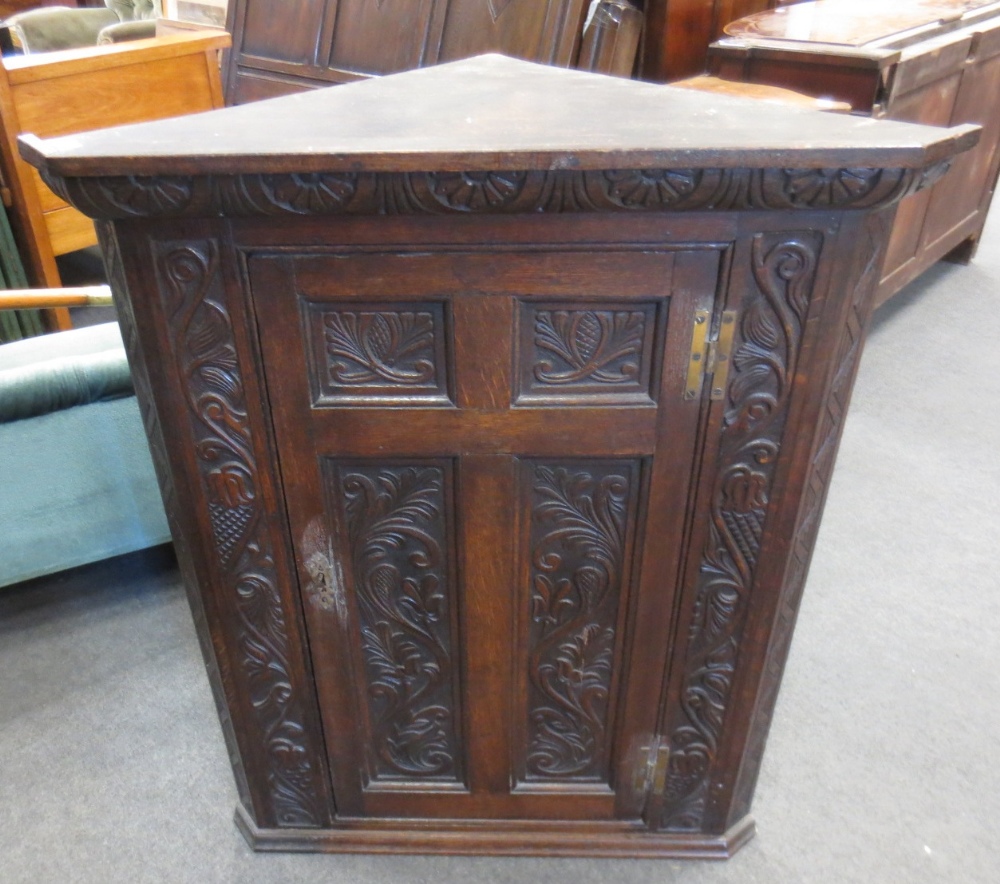 An oak corner cabinet