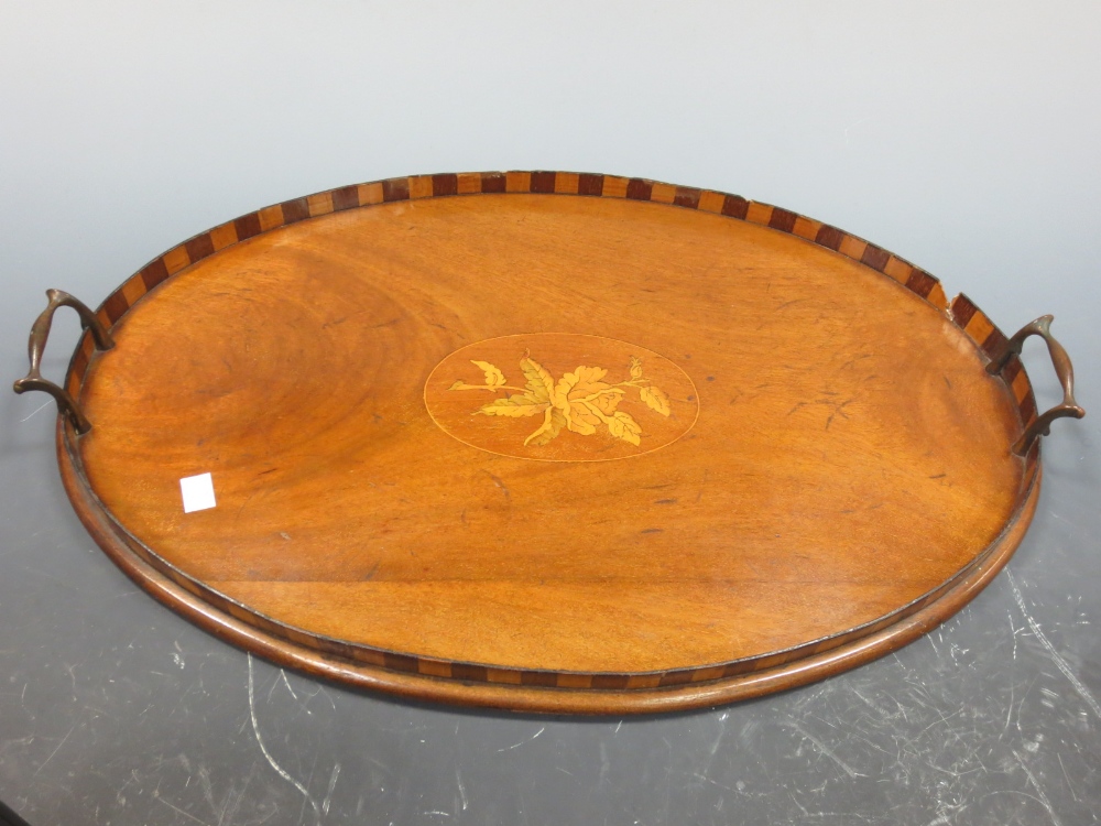 An inlaid mahogany oval tray