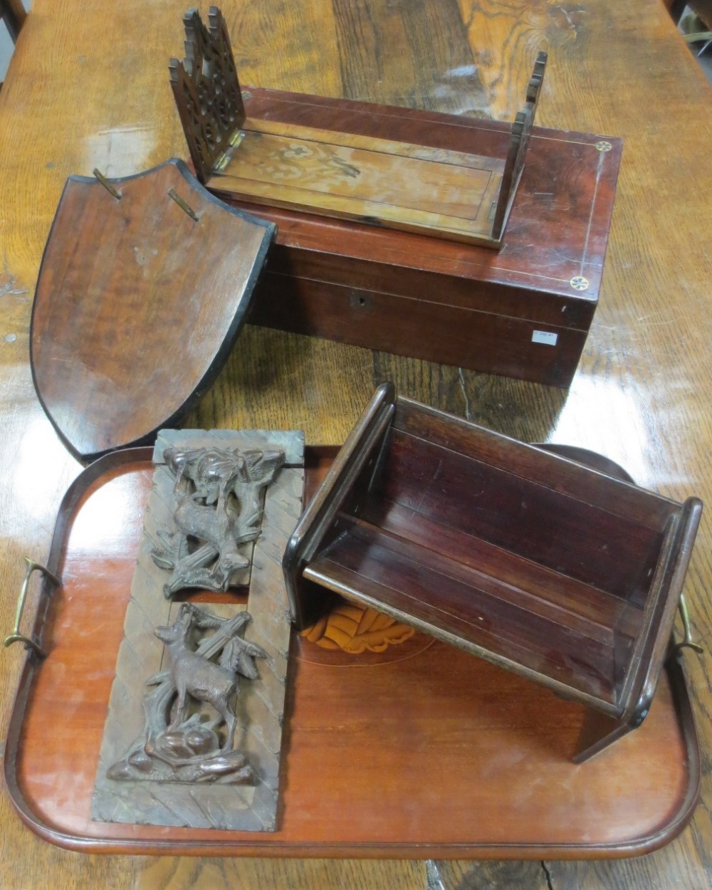 An inlaid mahogany tray together with a mahogany writing slope, two slide book ends etc.