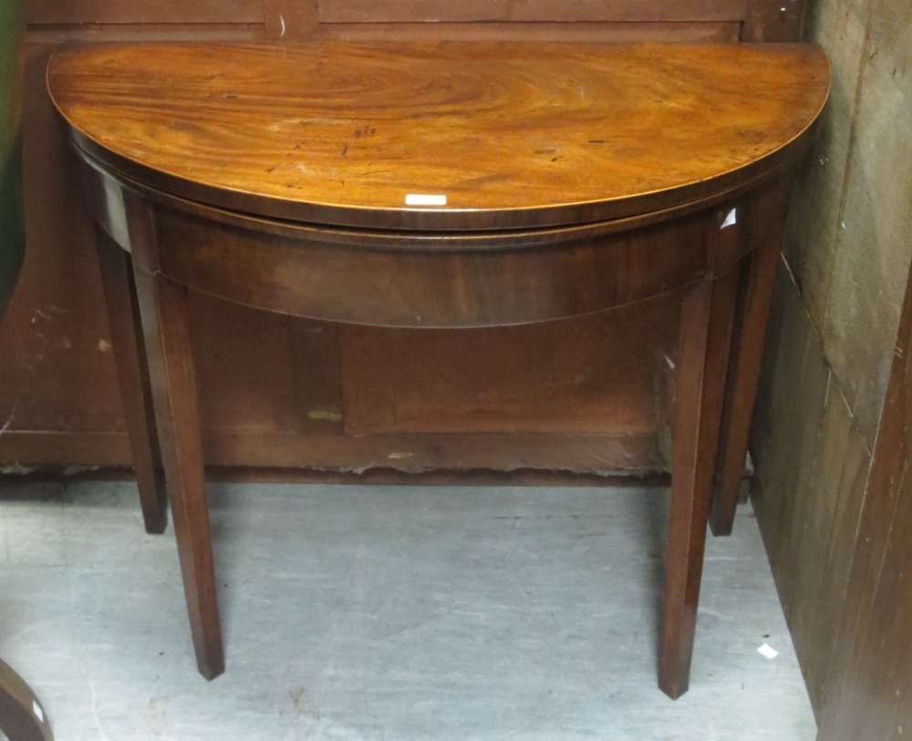 A George III mahogany D-shaped tea table