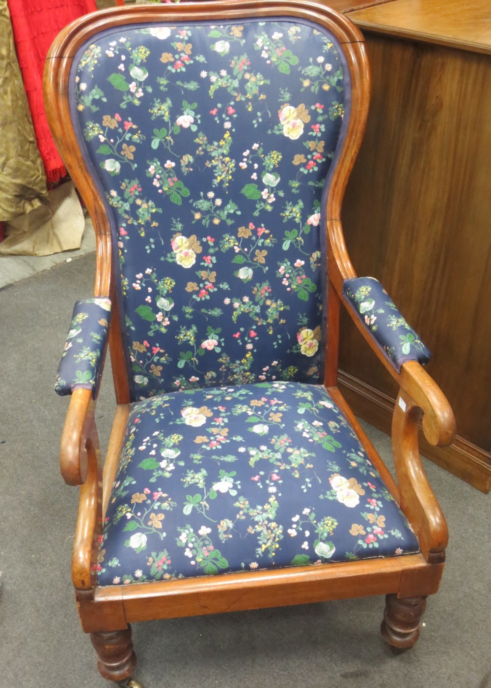 A Victorian blue floral upholstered open armchair