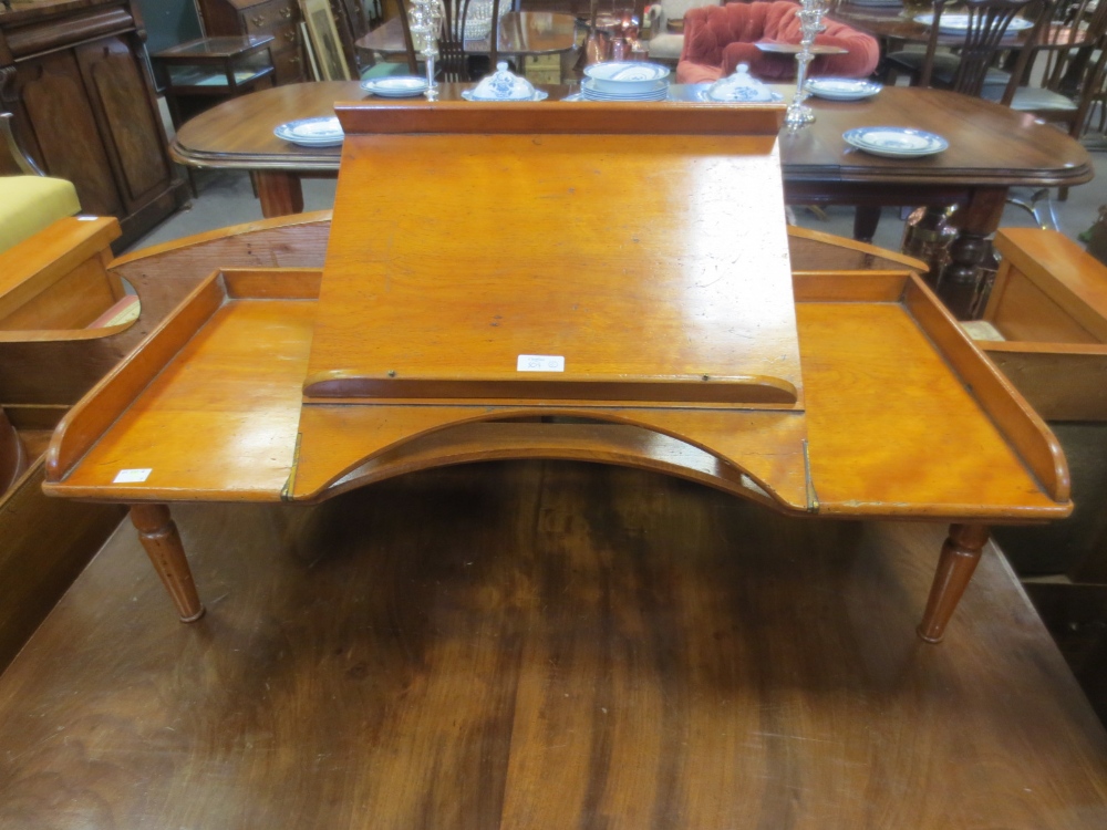 A satinwood galleried bed tray with hinged adjustable slope and a 19th century mahogany tripod