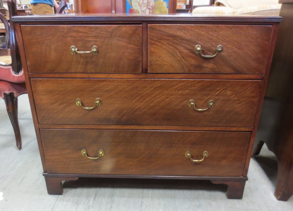 A 19th century mahogany chest of drawers. Height 84cm. Width 97cm. Depth 51cm.