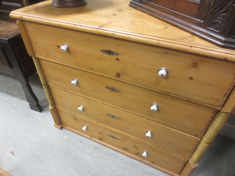 A large pine chest of four drawers, 108 x 128 x 60 cm