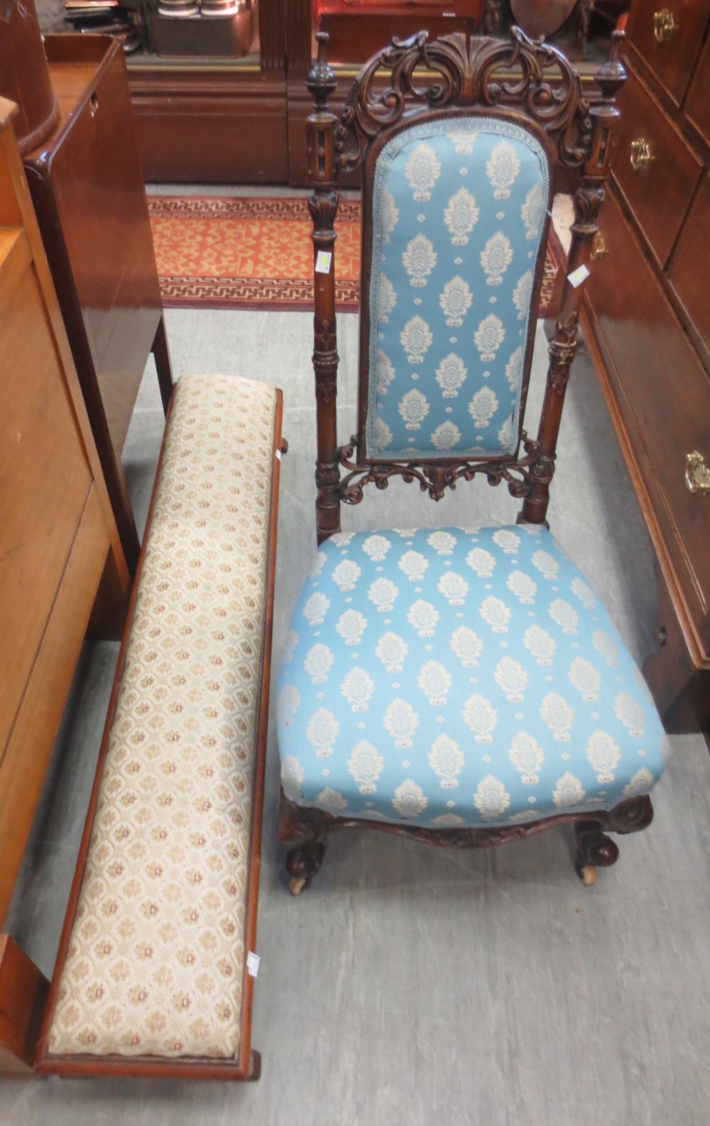 A Victorian carved pierced back side chair on scroll front legs and a long stool