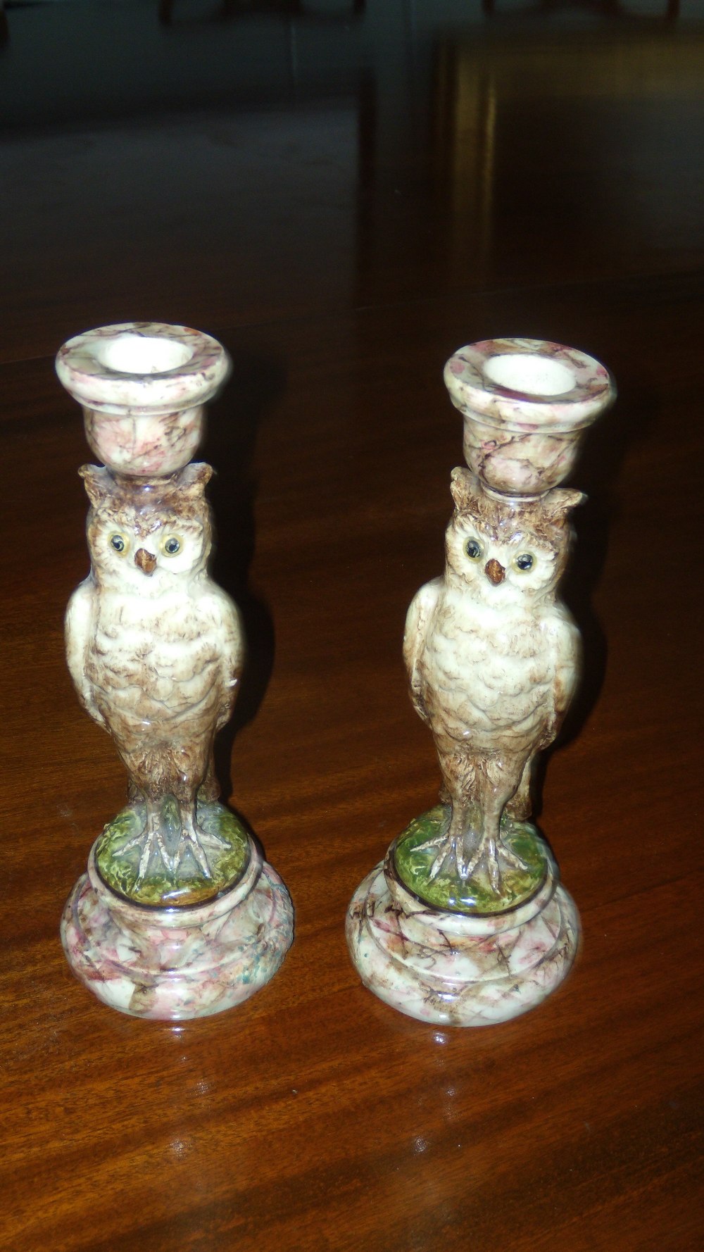 Jerome Massier, Vallauris, a pair of faience owl candlesticks, the open eyed birds standing on