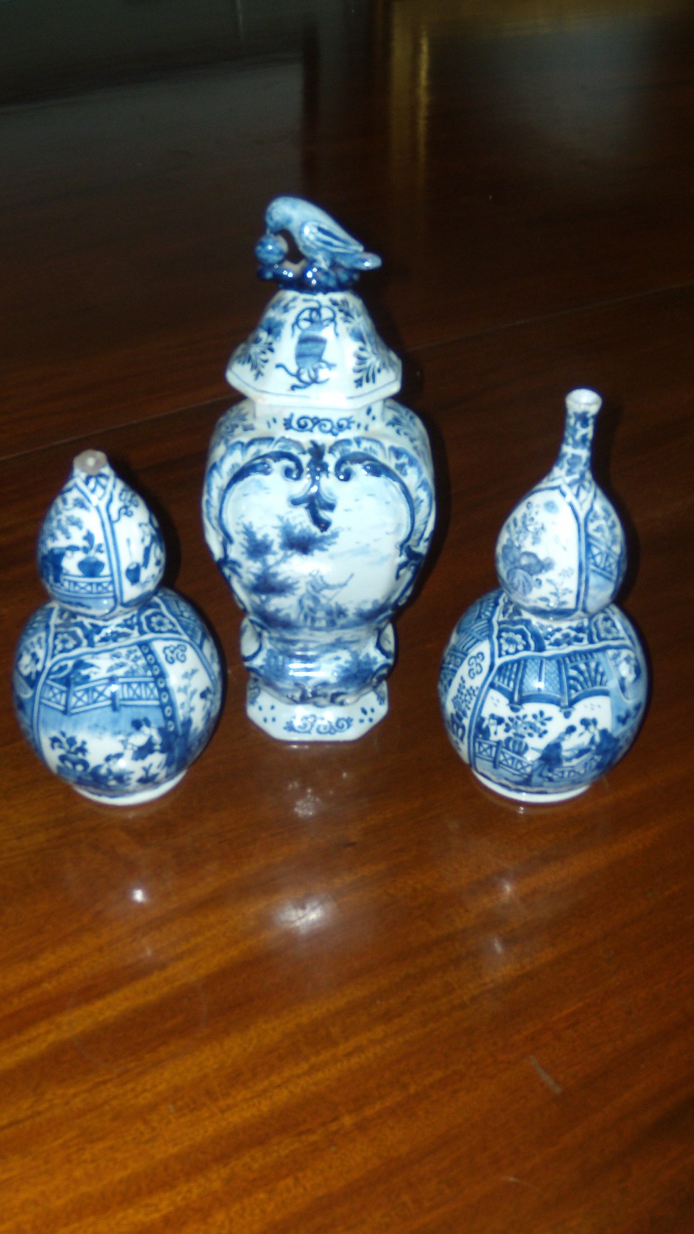 A pair of 18th century Delft blue and white double gourd vases painted with chinoiserie, 23cm (9