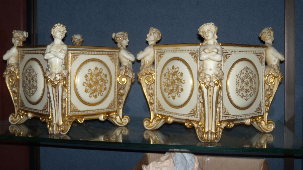 A pair of Mintons glazed parian orange tubs, datecode for 1887, the square sides gilt with ovals,