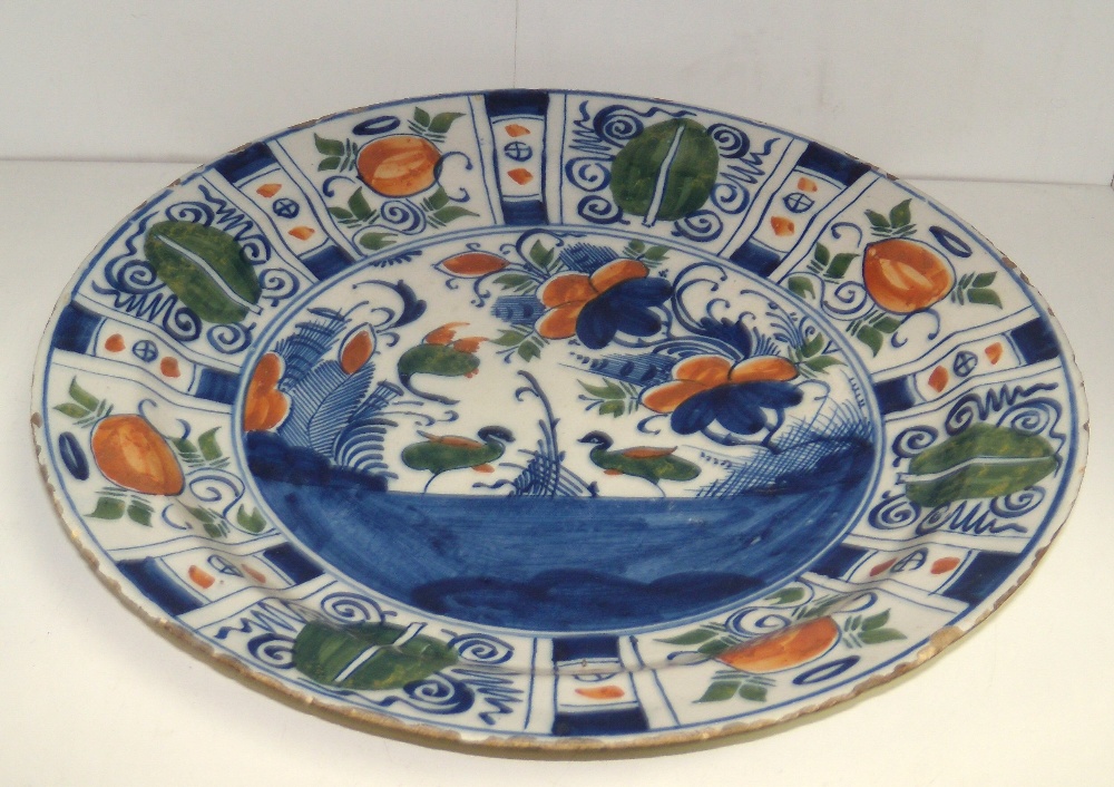 Two mid 18th century Dutch Delft polychrome dishes, one painted in the kraak style with two ducks