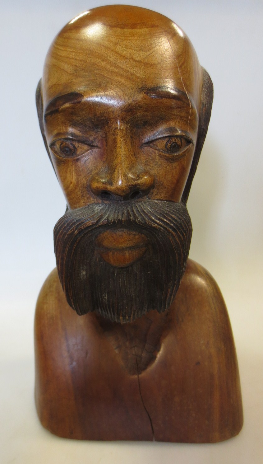 A Jamaican wooden bust of a man