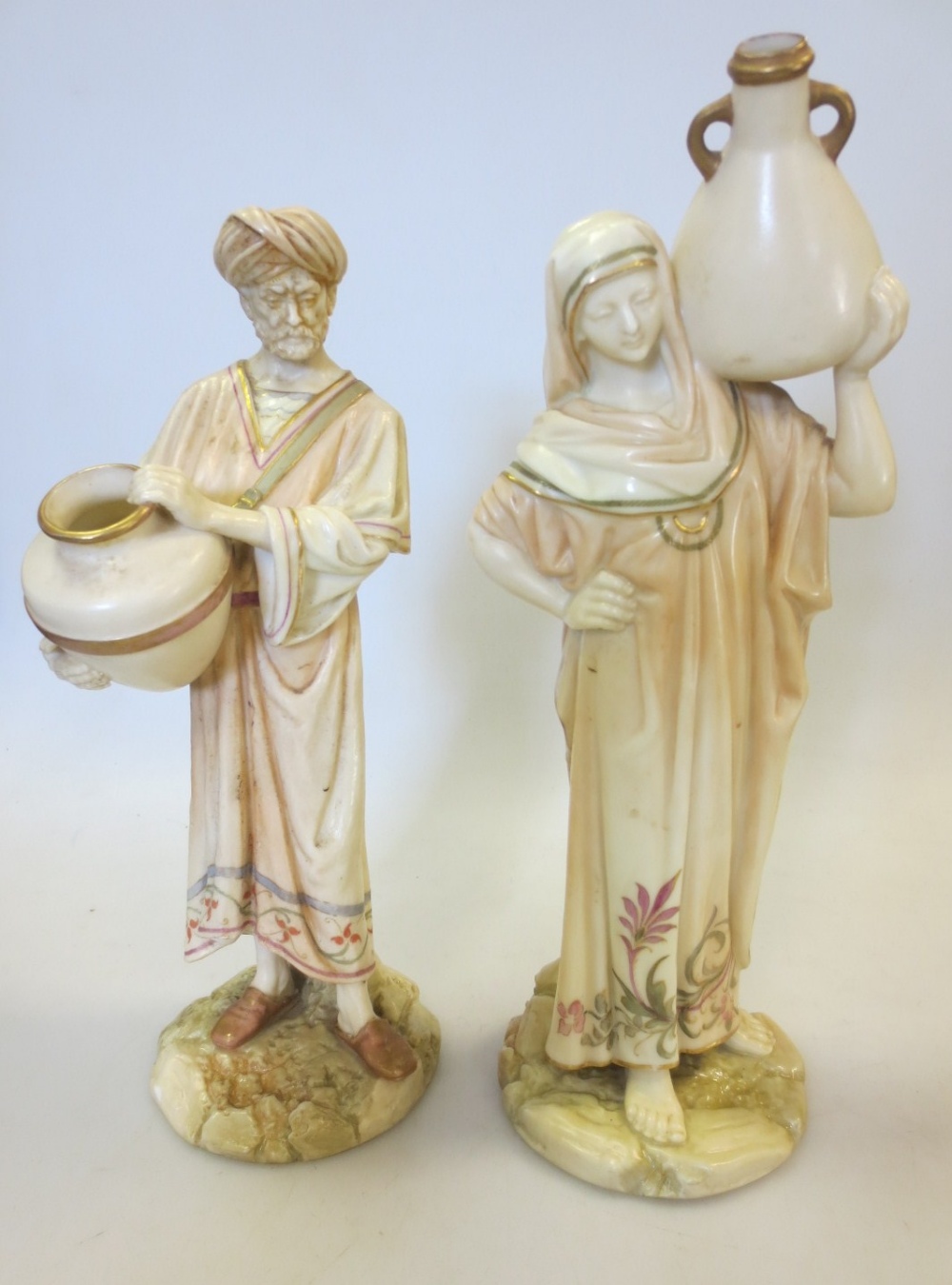 A pair of Royal Worcester water carriers