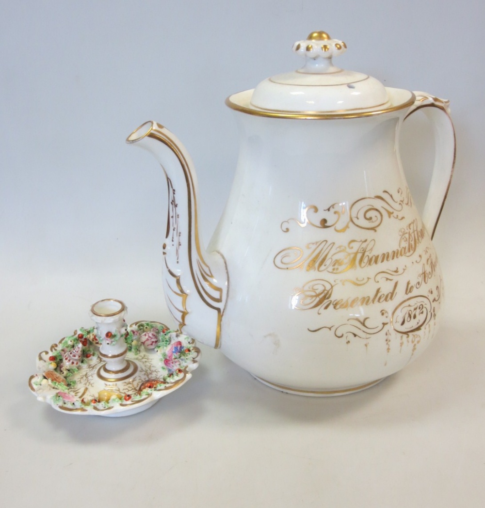 A 19th century floral painted oversize teapot with a 1872 inscription in gilt, together with a