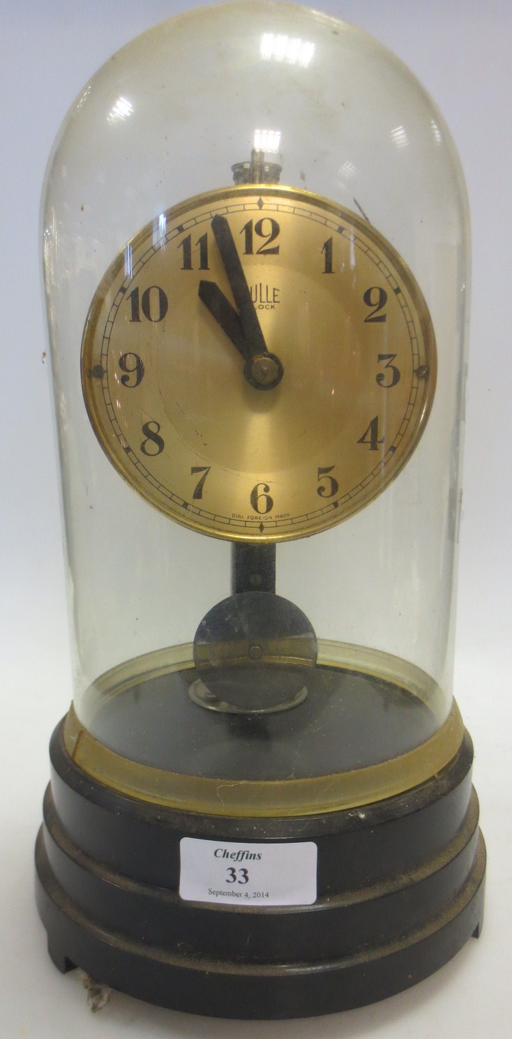 A Bulle electric clock under dome