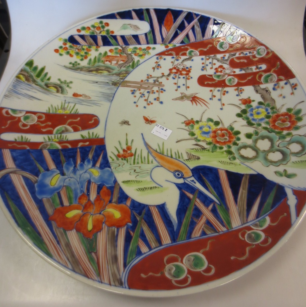 A Japanese Imari dish 30.5cm diameter, and another larger 40.5cm diameter (2)