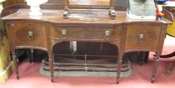 An Irish Regency mahogany sideboard with galleried back and on reeded turned legs, 93 (h) x 214 (w)