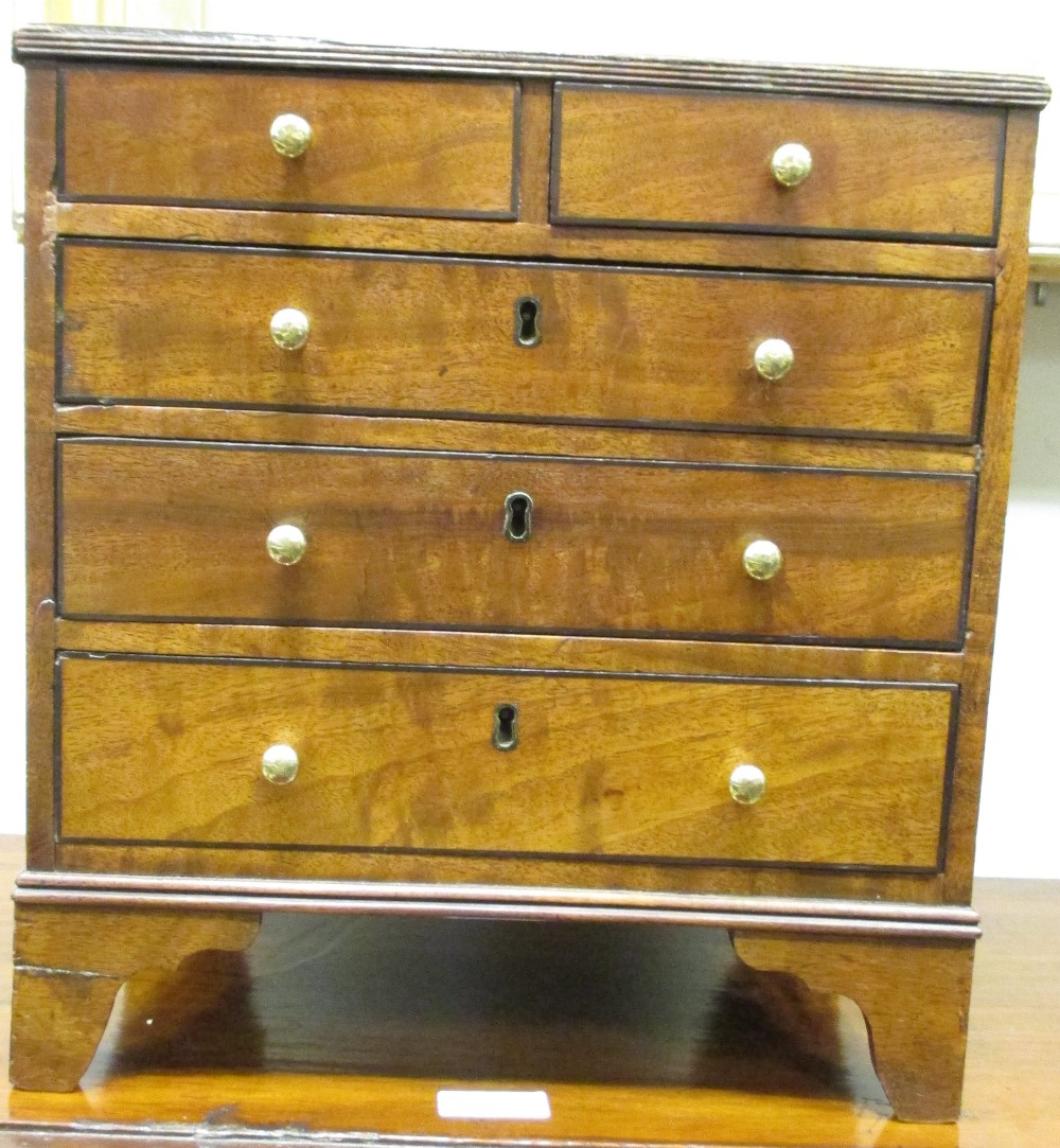 A miniature mahogany chest of drawers, 33cm (h) x 31cm (w)