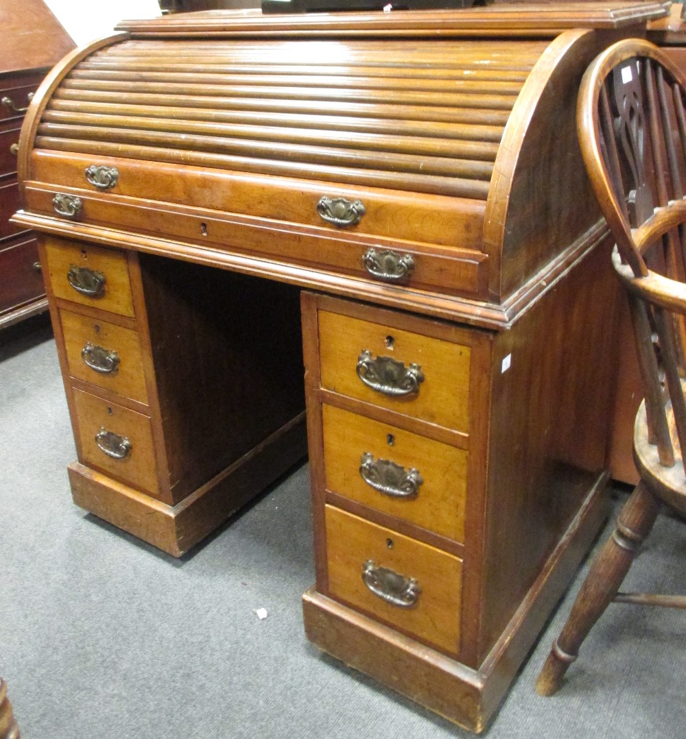 An Edwardian mahogany tambour fronted pedestal desk, 95cm (h) 92cm (w) 57cm (d)