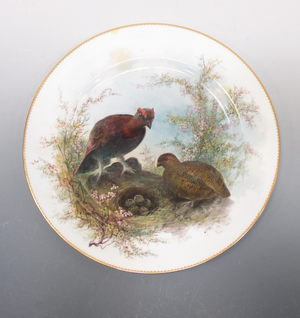 A Minton plate painted with grouse by a nest by William Mussill, 26cm (10.25 in) diameter