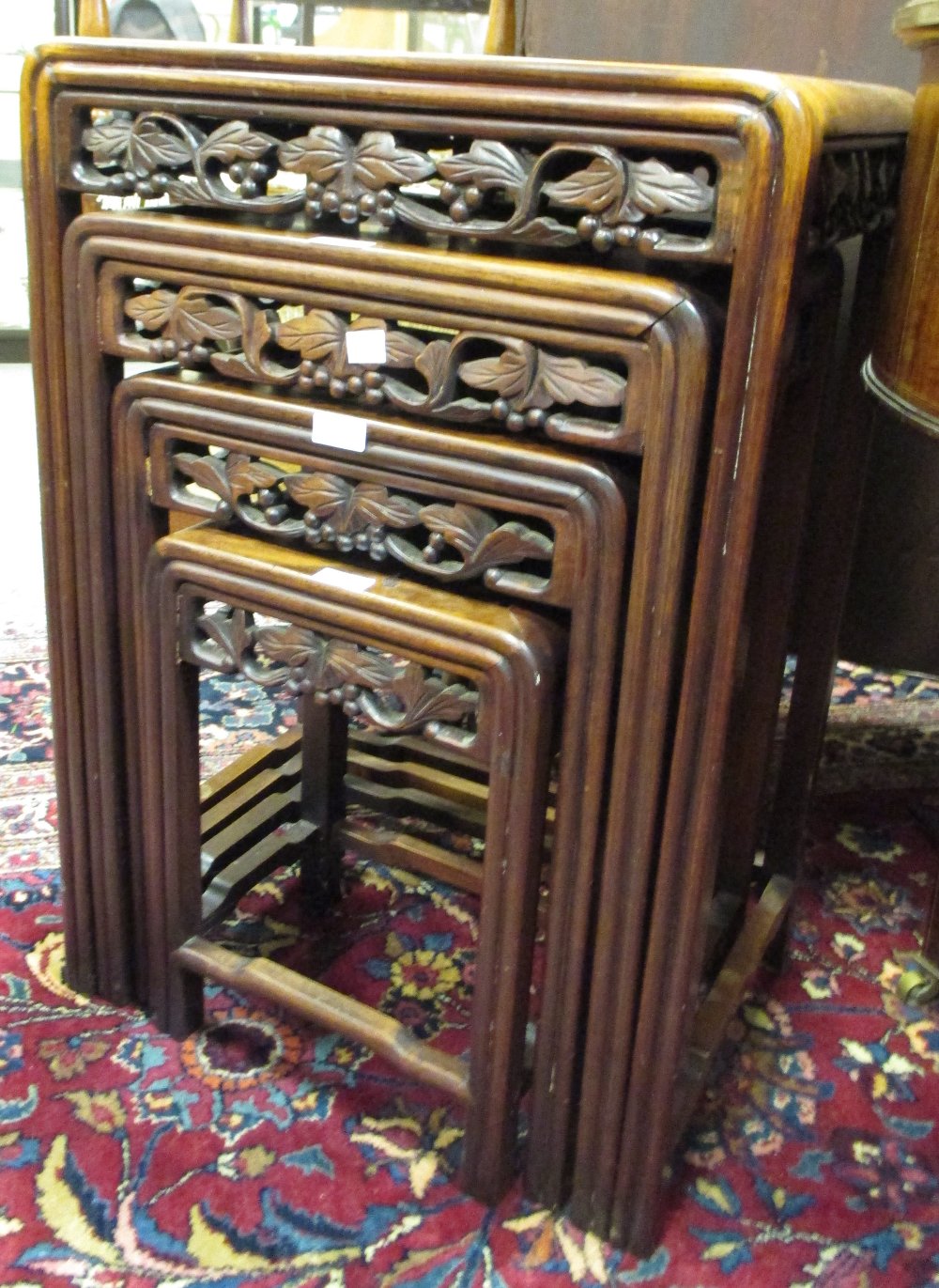 A nest of four Chinese hardwood occasional tables
