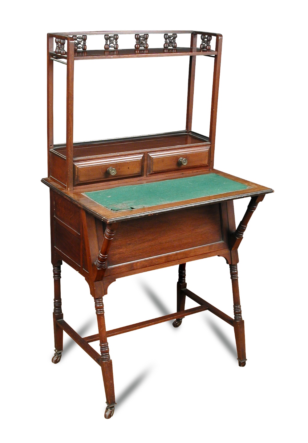 An Arts & Crafts Moorish style mahogany writing desk in the manner of Christopher Dresser, with