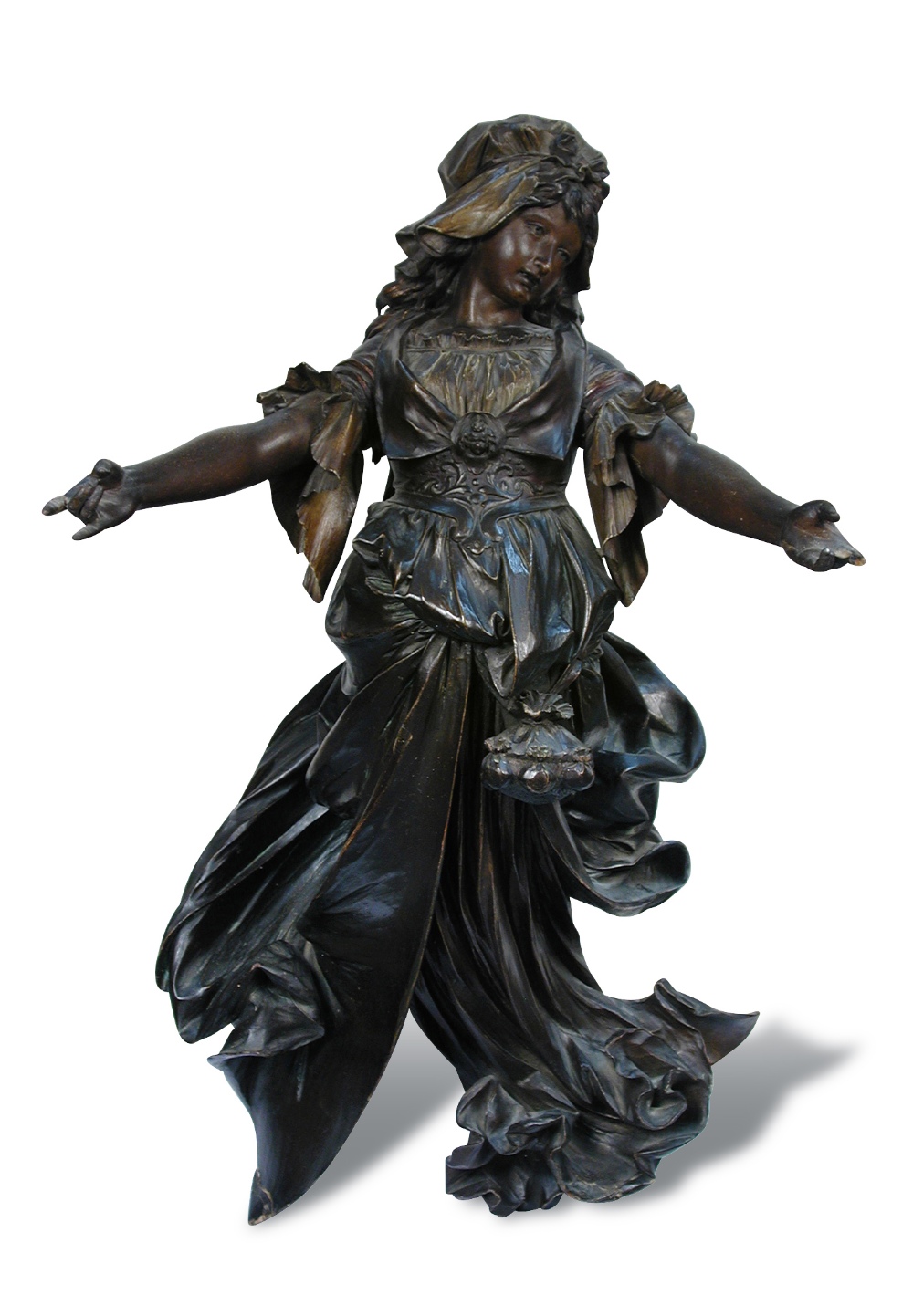 A late 19th century tinted wood figure of a lady opening her arms in greeting, her cap and frilled