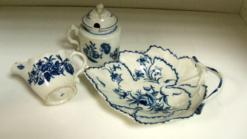 A Worcester blue and white dish, a cream jug and a Caughley mustard pot and cover, each printed