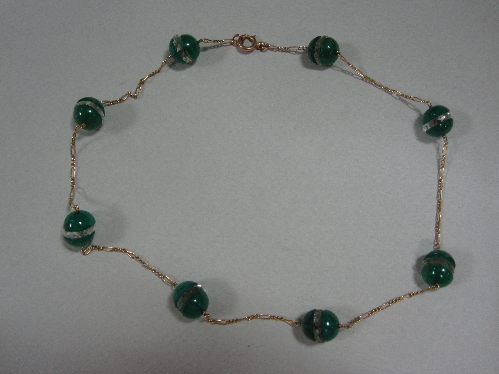 A chrysoprase and rock crystal necklace, constructed as a fine fancy curb link chain punctuated at