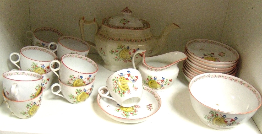 A New Hall type tea service, each piece painted with a yellow shell amongst flowers similar to New